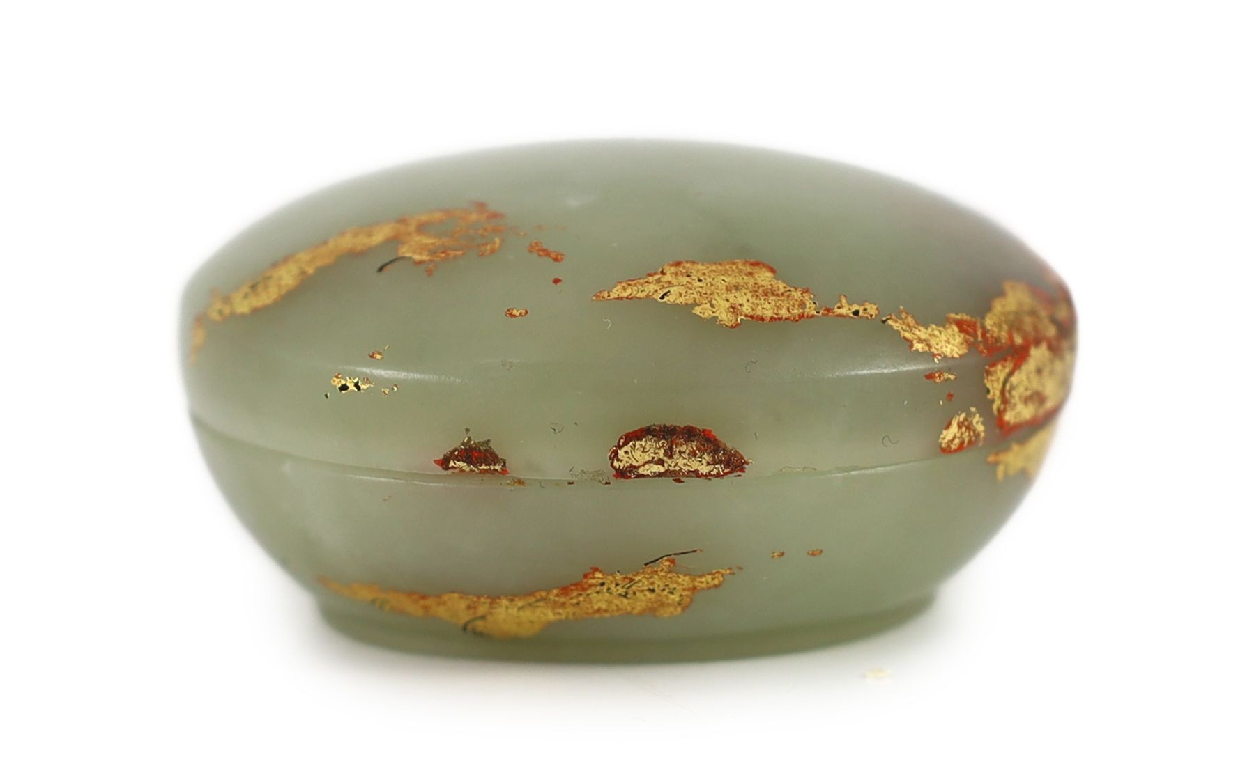 A Chinese pale celadon jade box and cover, 18th century, remnants of gilt lacquer decoration, 6cm wide